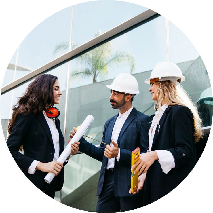 3d-rendering-modern-dining-room-living-room-with-luxury-decor 3 Three construction professionals in hard hats discussing project plans, with blueprints and measuring tools, in front of a modern building, emphasizing collaboration and expertise in commercial construction services.